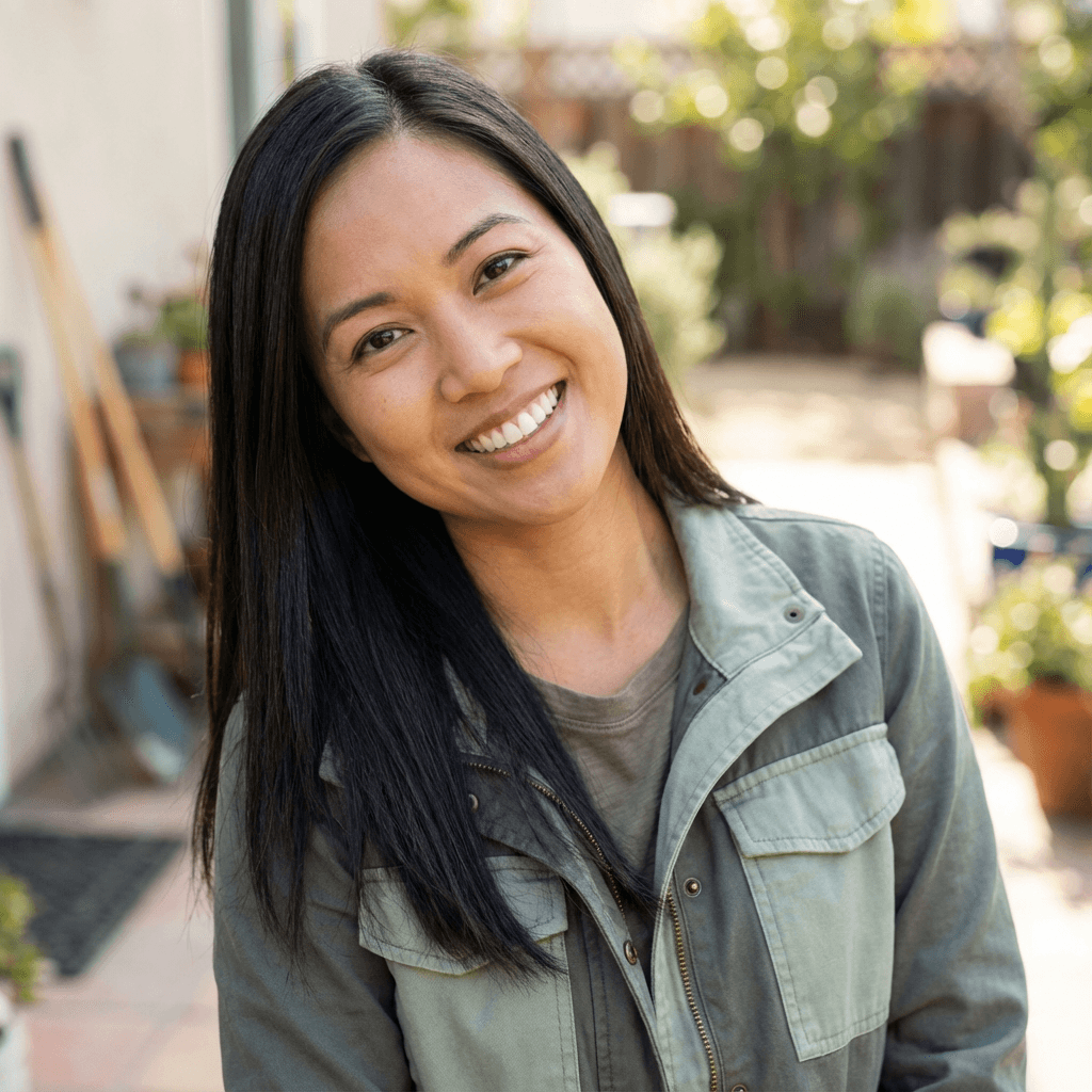 Margaret Chen, daughter of a home care client, smiling warmly